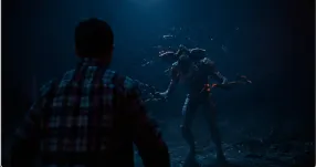 Demogorgon confronting a person in a dark forest scene from Stranger Things.