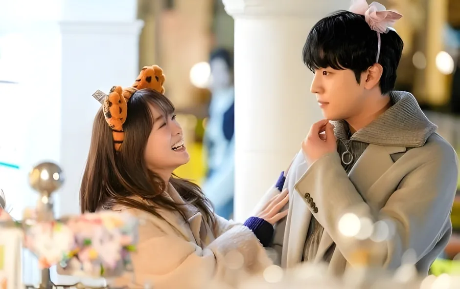 Couple in a playful moment, smiling at each other while wearing cute animal headbands, creating a romantic and lighthearted atmosphere.